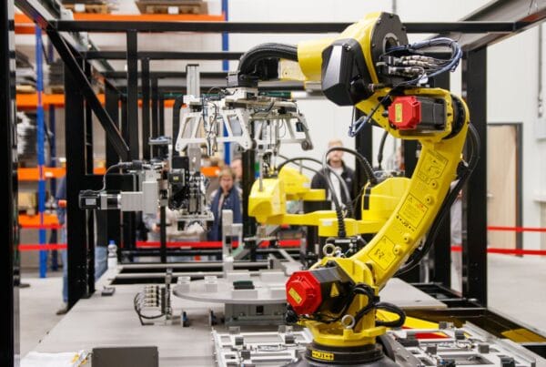 Industrial robotic arm representing AI automation for Texas manufacturers - Marinum Consulting Industrial robotic arm representing AI automation for Texas manufacturers
